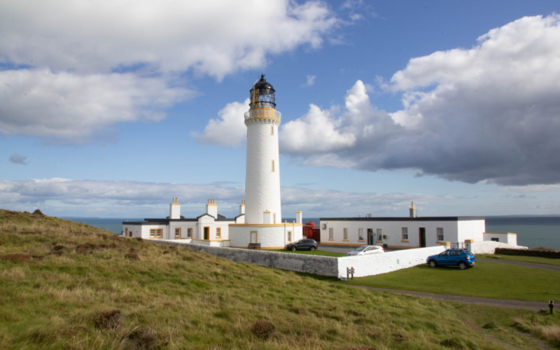 a lighthouse on a hill