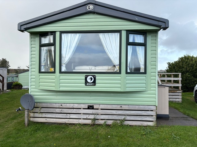 Swift Loire static caravan interior - open plan living and kitchen area in luxury holiday home
