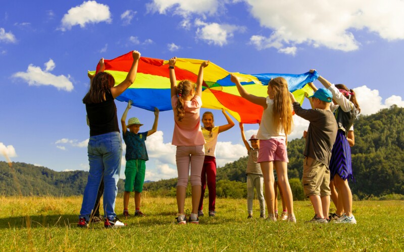 kids playing with parachute